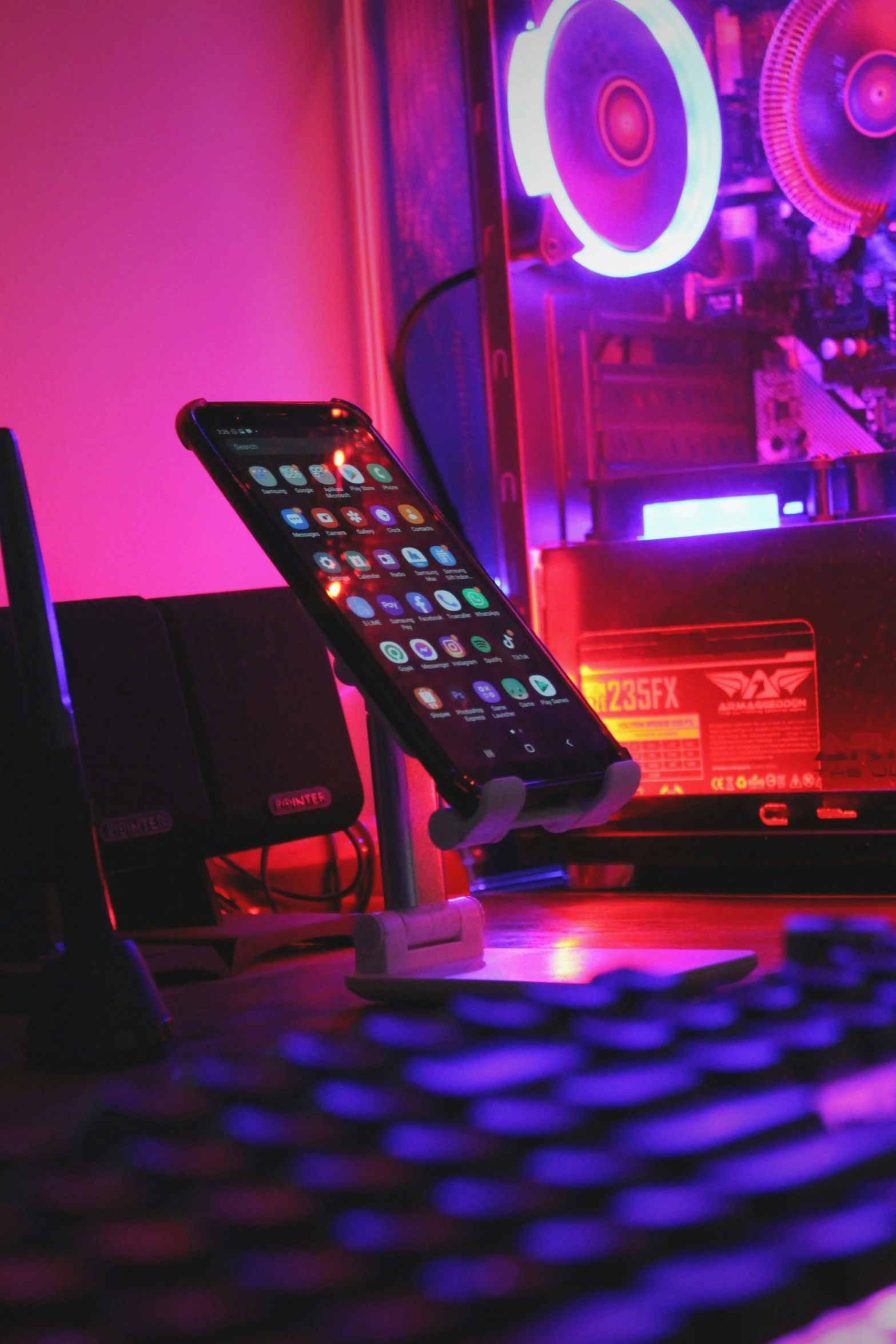 a remote control sitting next to a computer keyboard