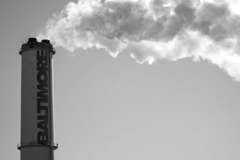 smoke is coming out of an industrial pipe