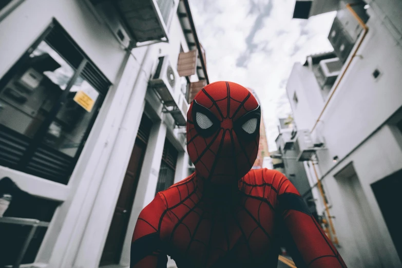 a person wearing a red costume looking up at the sky