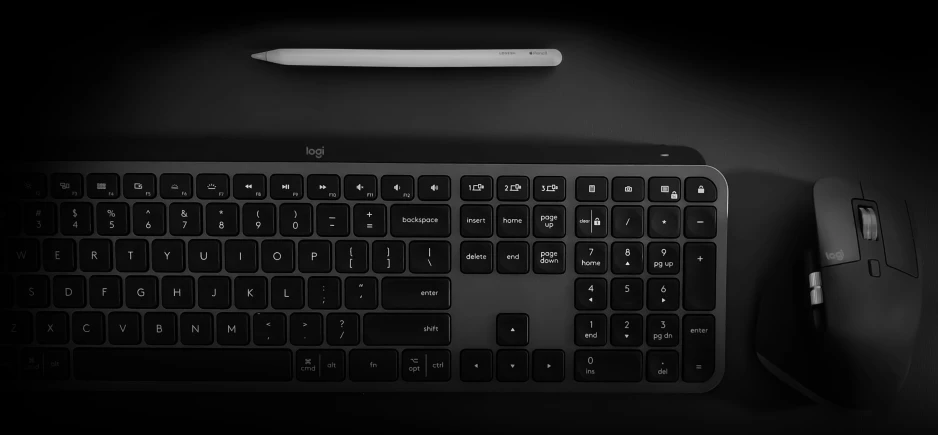 the black keyboard is next to a black mouse