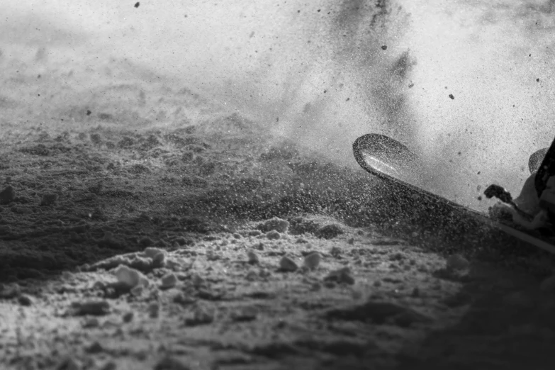 a man riding a board through a big wave