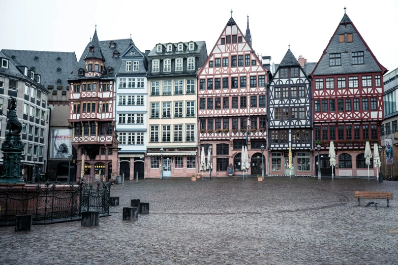 a large group of buildings that are standing in the dirt