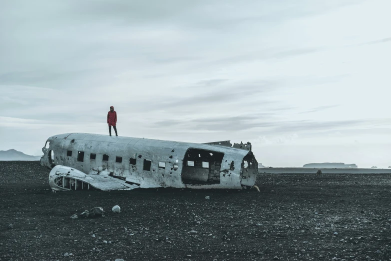 a person standing on the top of an old aircraft