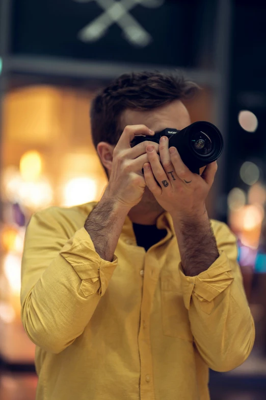 a man taking a picture with a camera