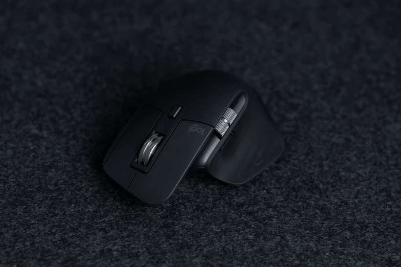 the mouse is placed next to a black object