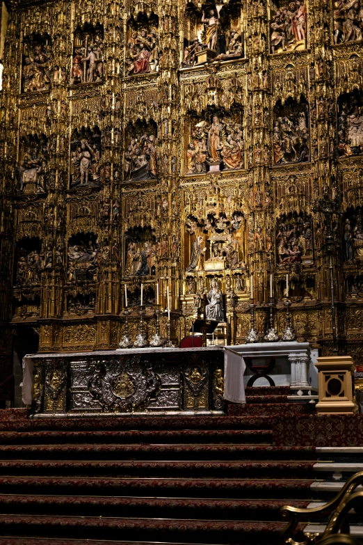 an elaborately decorated church with many golden and black items