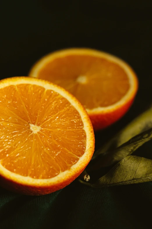 two orange slices that are close to each other