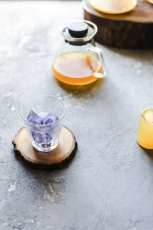 several bottles with ice in them sitting on top of the table