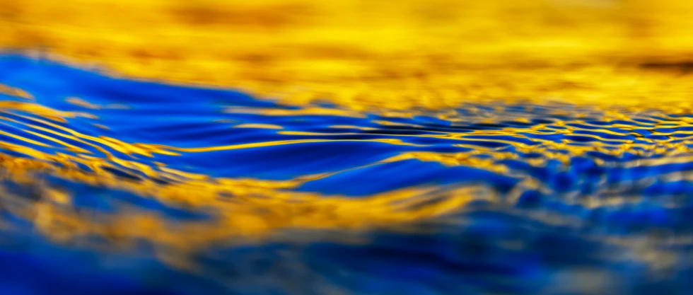 water flowing on a wet surface with yellow lines