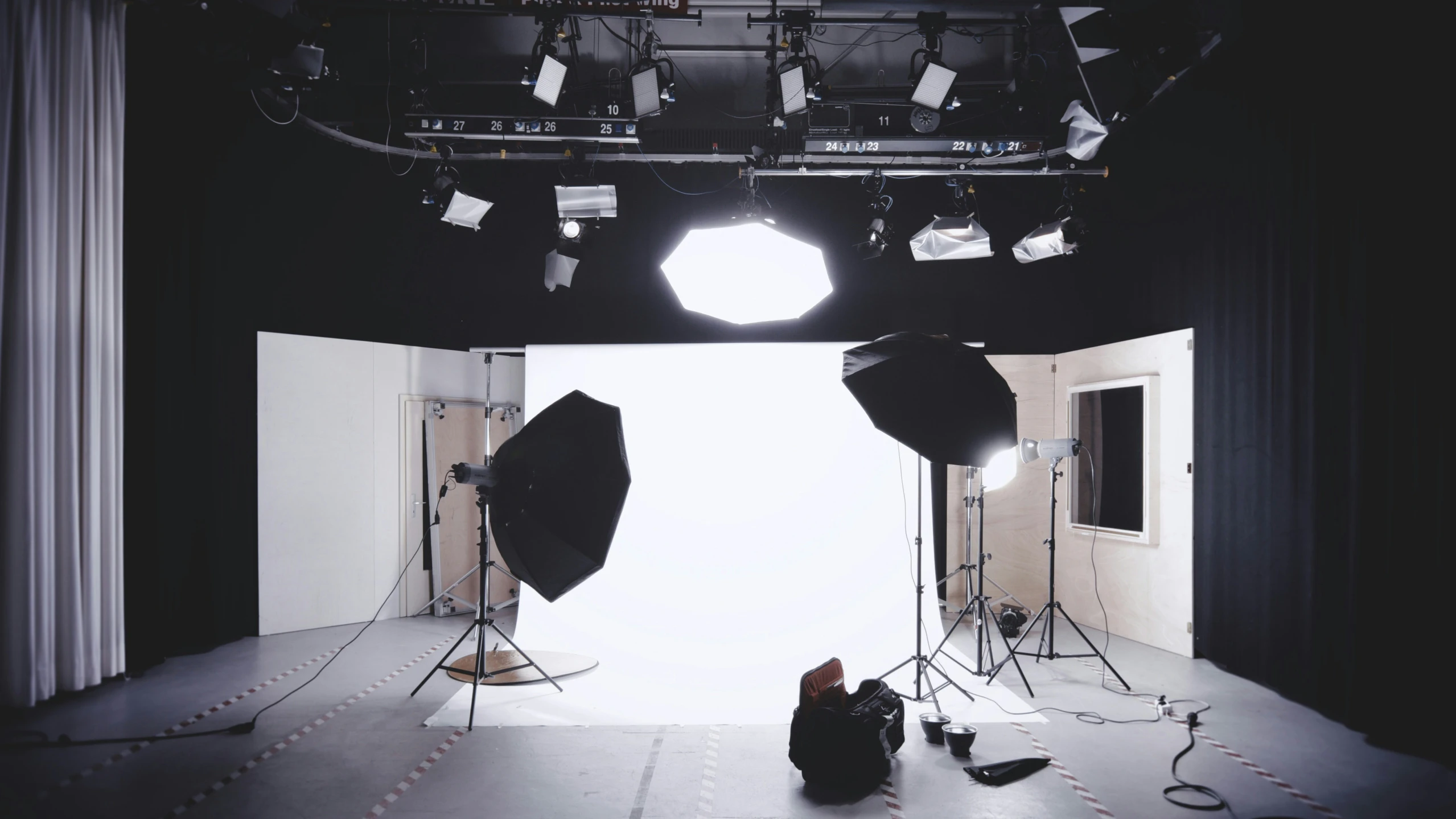 two lighting lights are set up in front of a stage and light