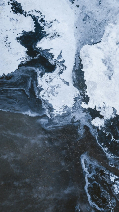 a black and white image of water and ice