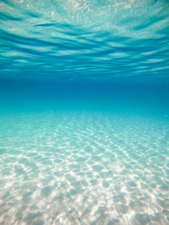 the blue water is so calm that it's so clear