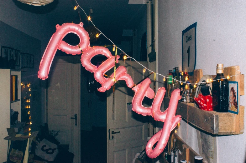 a very bright neon pink bubble type party banner