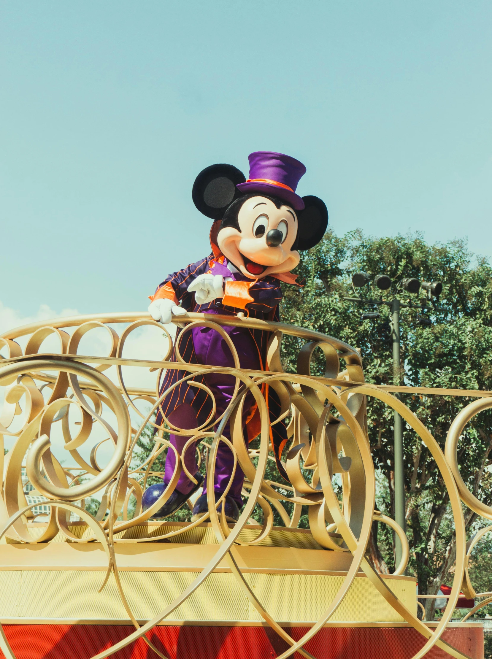 an inflatable mickey mouse on a platform at disneyland