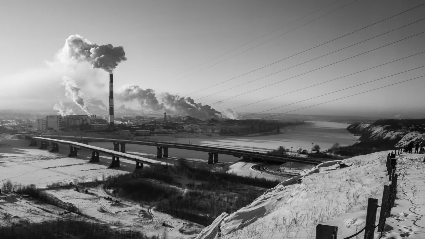 a black and white po of power plants coming from the smoke stack