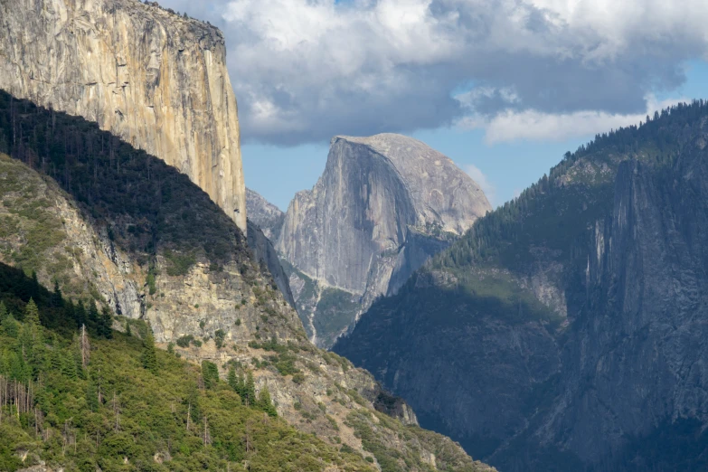 the view of mountains that line a valley