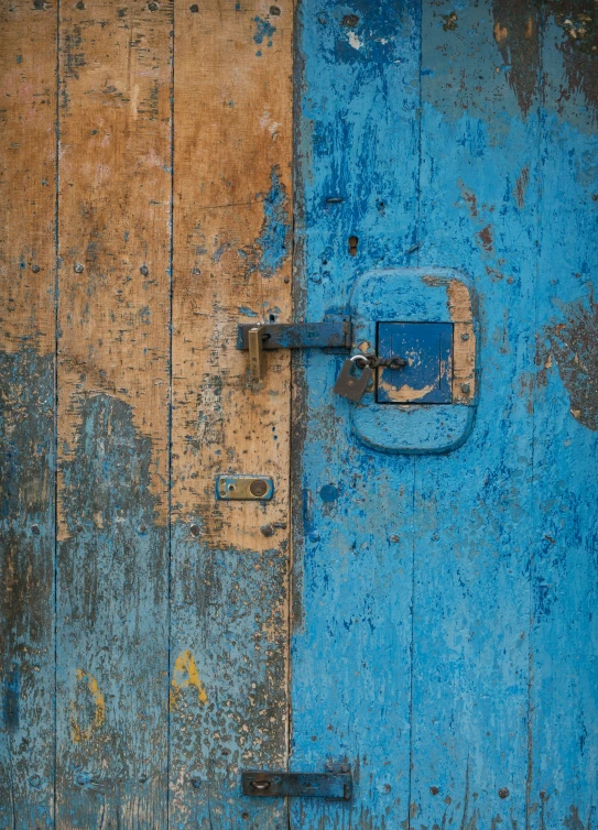 two color wooden door with lock and key