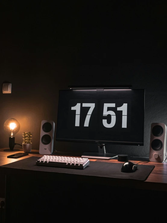 a computer screen with a keyboard sitting on top of it