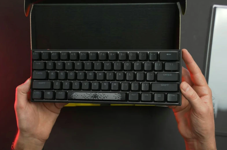 a black keyboard that is in a box