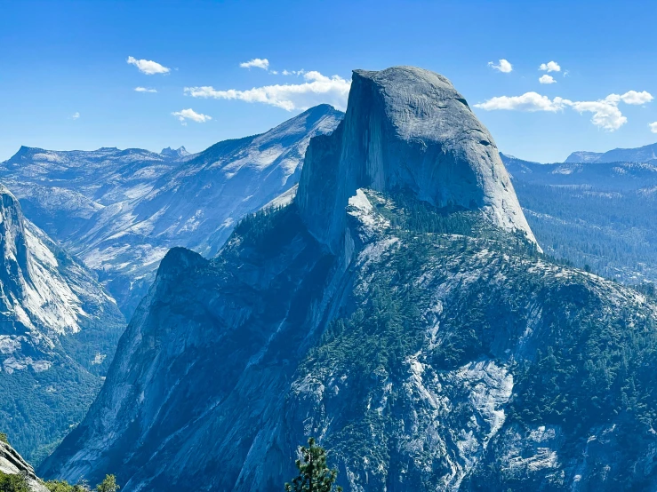 a beautiful view of some mountains with a sky background