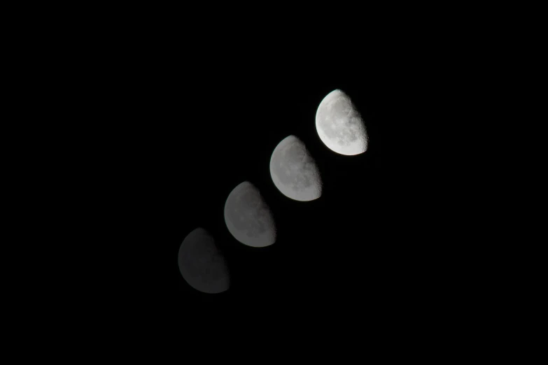 a group of six phases of a moon in the night sky