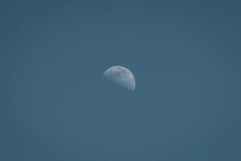 a crescent eclipse in the sky on a clear day