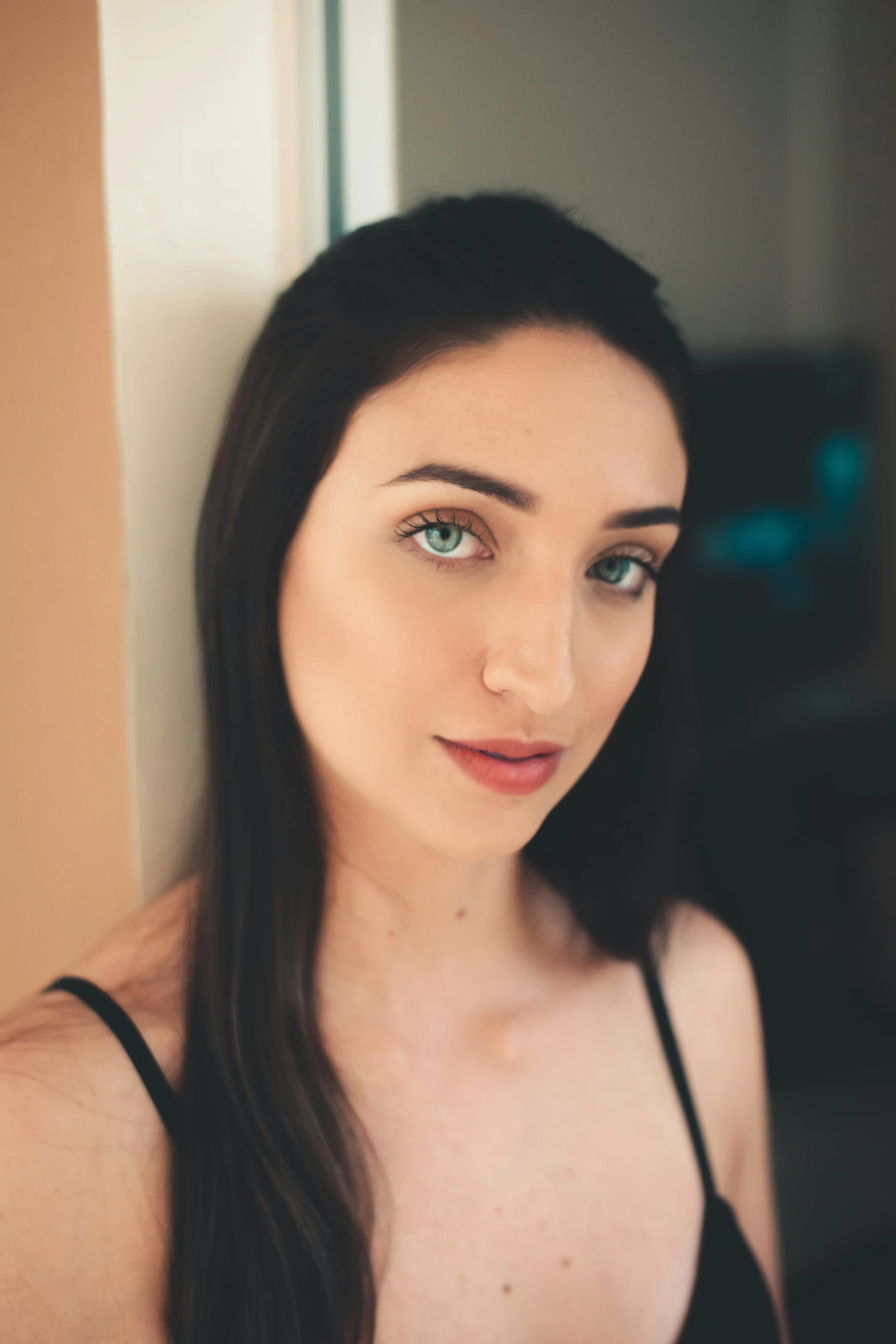 a woman in a black tank top and her long hair