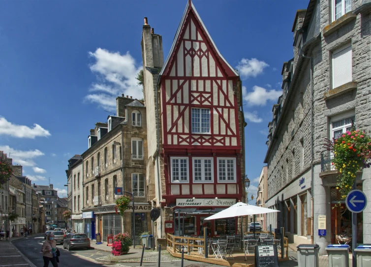 an old building sitting next to a street