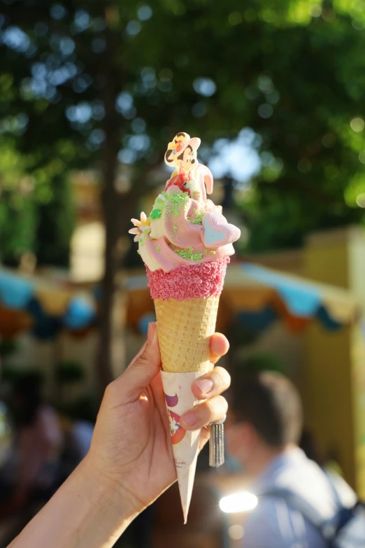 there is a pink ice cream with sprinkles