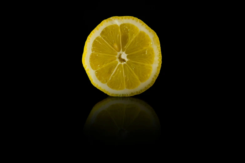 a slice of lemon on a black background