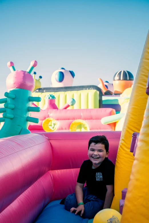 a  is sitting in a inflatable bouncy castle