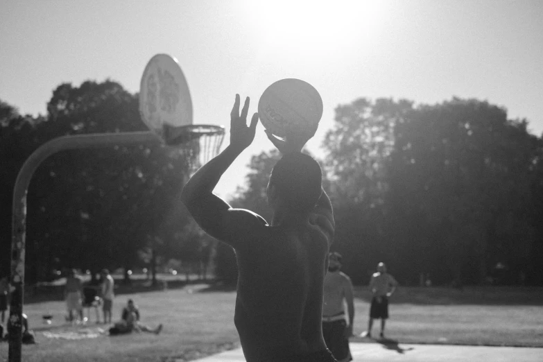 the basketball player is throwing a ball to the other team