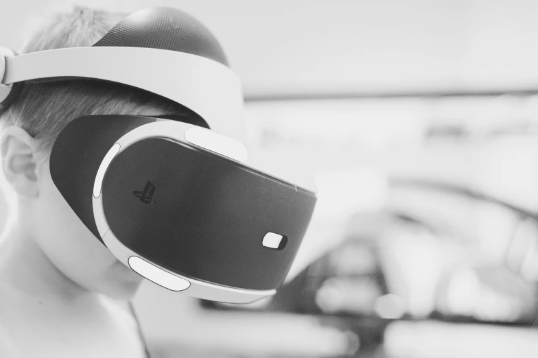 black and white pograph of a woman wearing a google headset