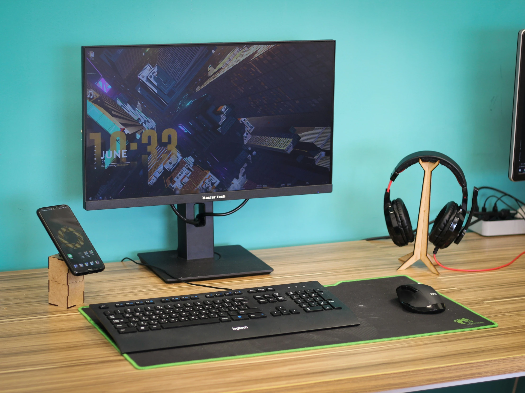 a desktop computer with headphones sitting on a desk