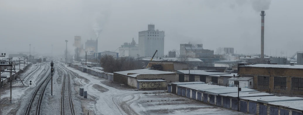 a train station and city with snow