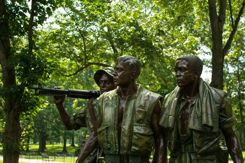 a statue of some men with a gun