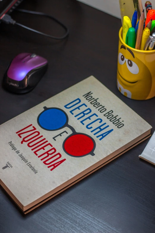 a book with a mouse and a keyboard on it