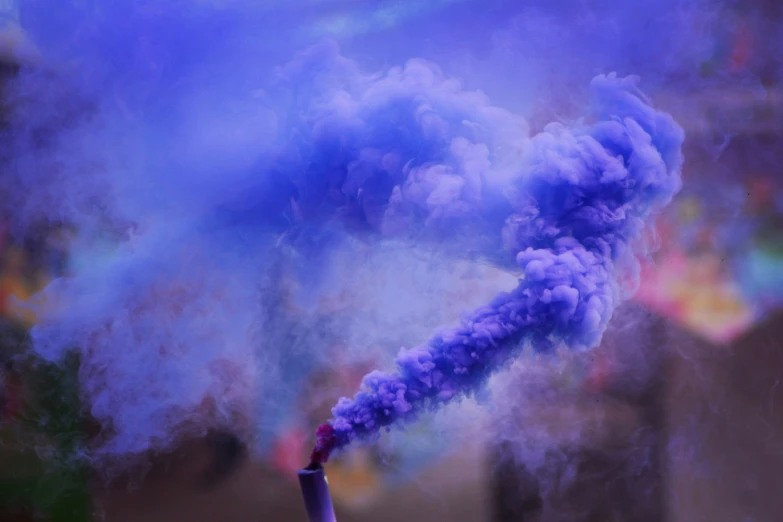 blue smoke emitting from a pipe on a stand