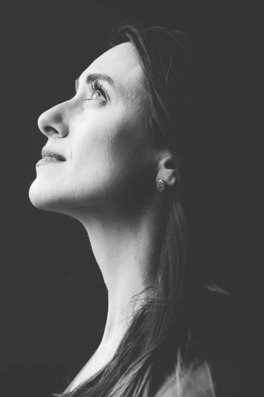 a black and white po of a woman's profile