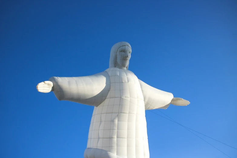 a statue with two arms in the air