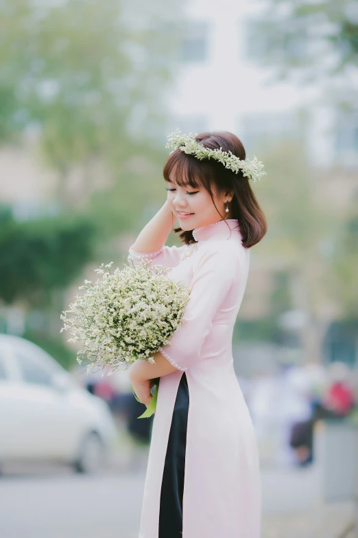 a woman with a bouquet and a white dress