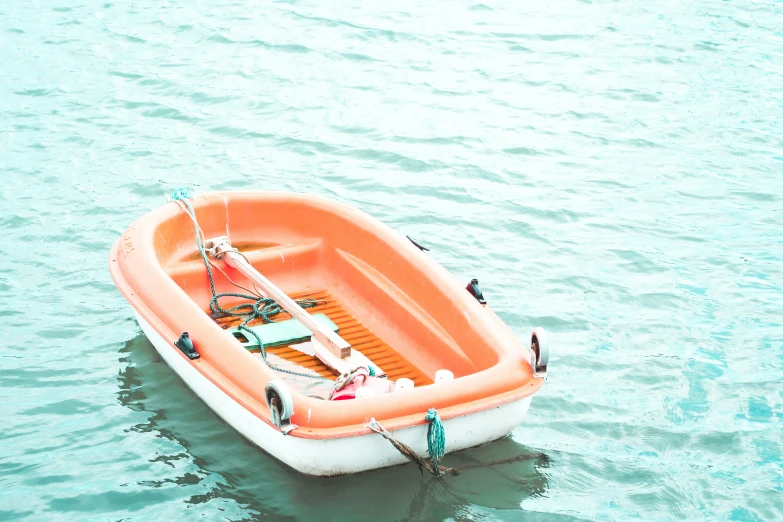 a small boat that is floating on some water