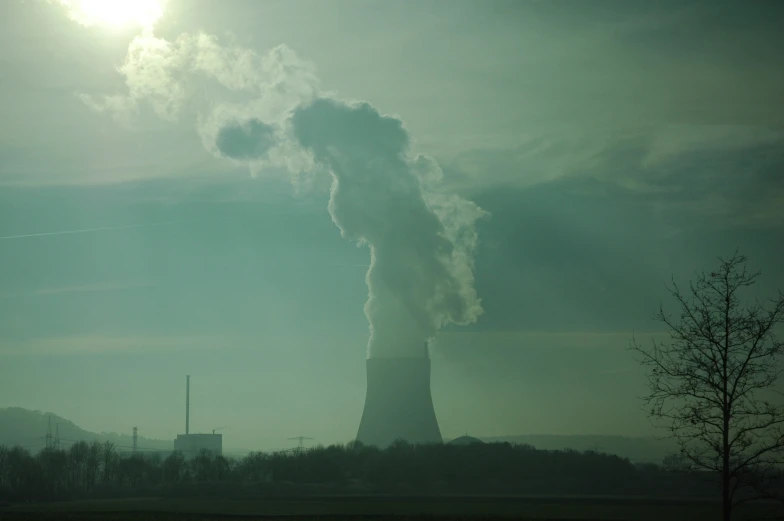 the smoke comes from the factory chimney into the sky