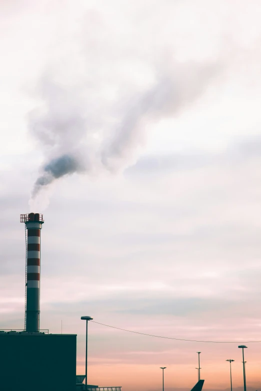 smoke comes from a chimney from the back of an airplane