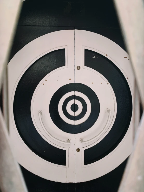 a close up image of a black and white bulls eye target