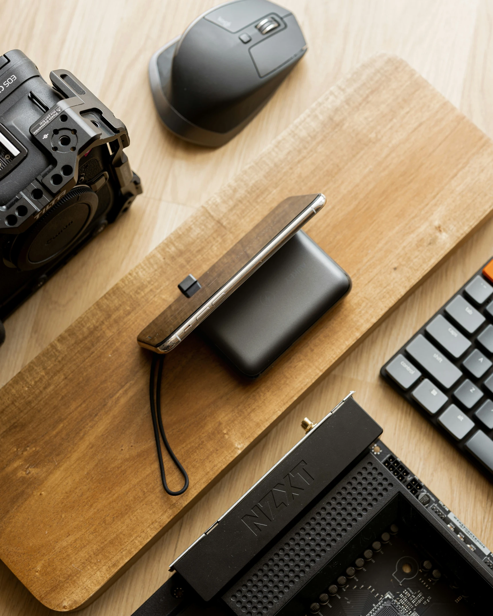 a camera sitting next to a computer keyboard