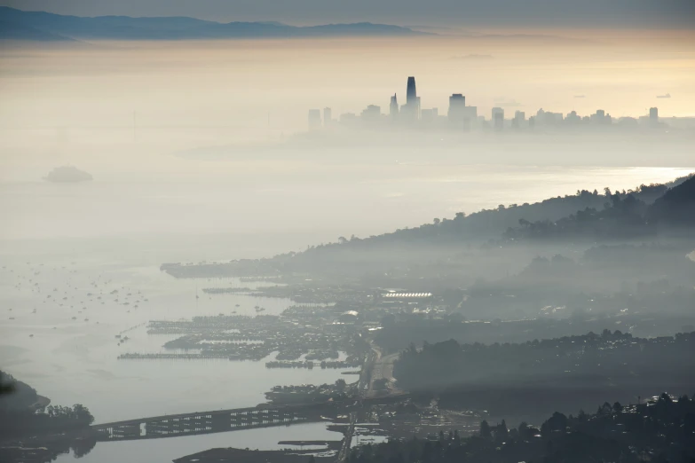 an aerial view of a cityscape with mist