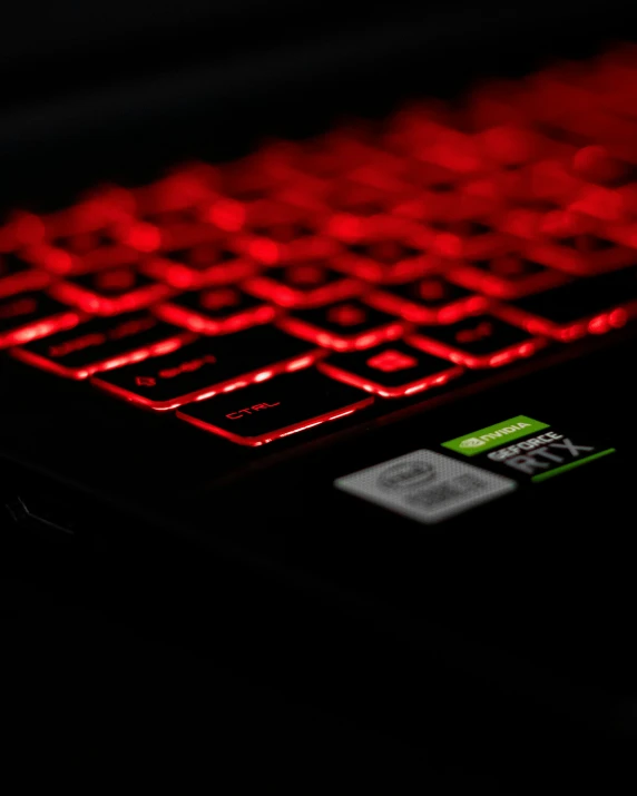 the laptop computer has a red glowing keyboard