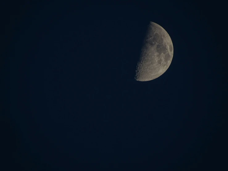 a half moon seen in the sky at night