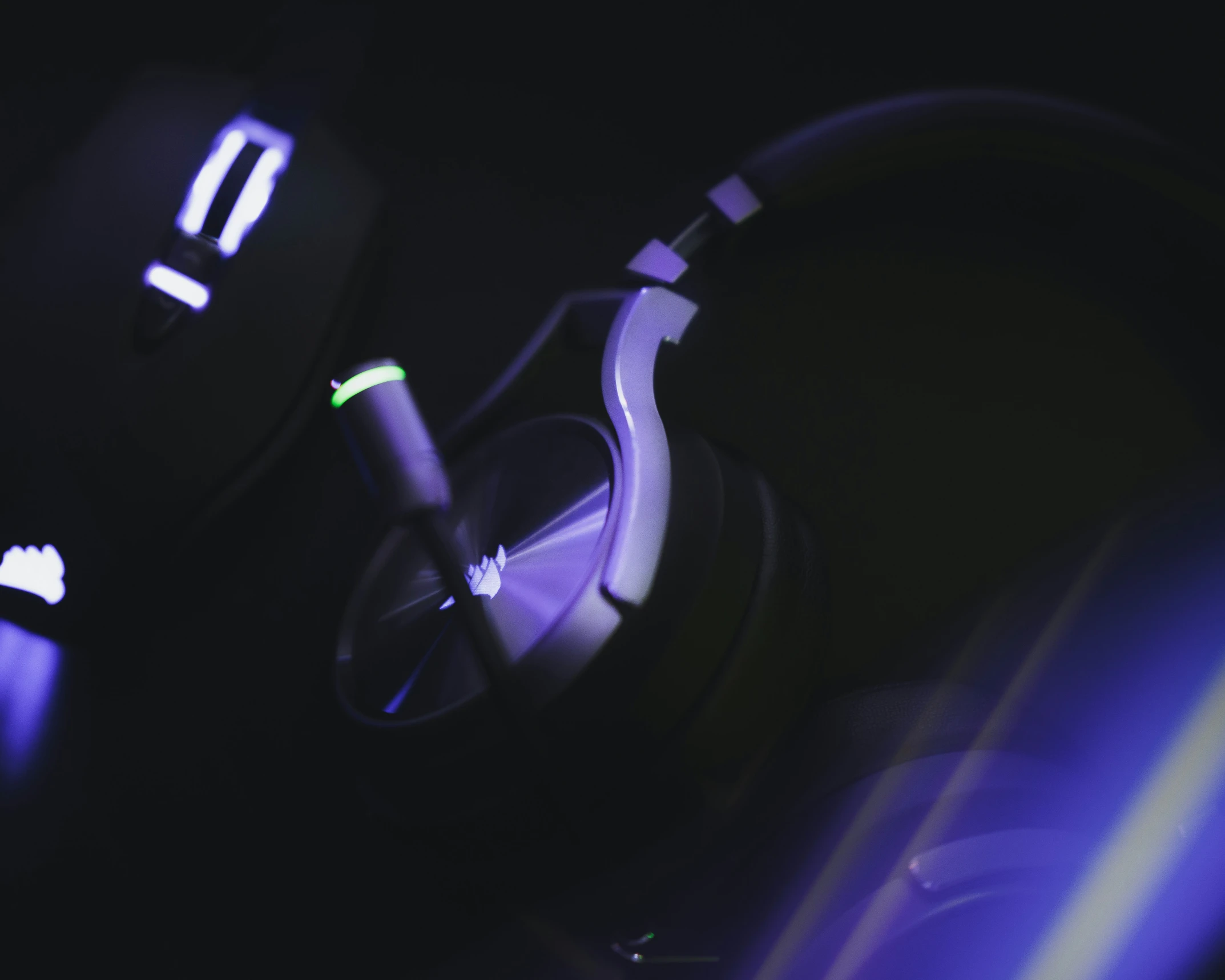 a close - up image of a black headphones in a dark room